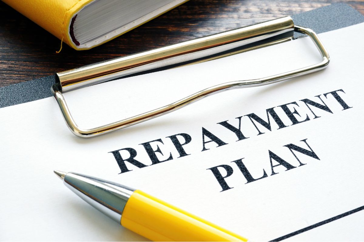 Image of paper with repayment plan wording.