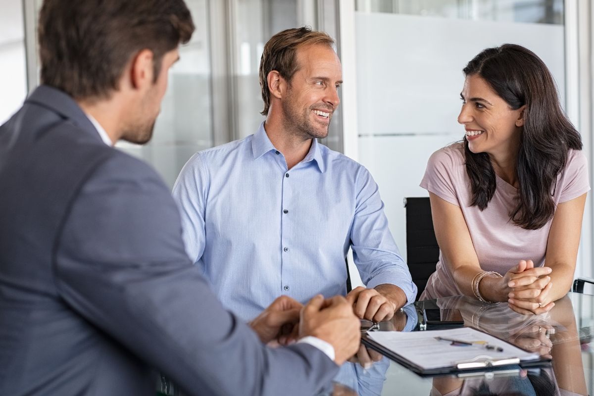 Picture of a financial advisor and his clients.