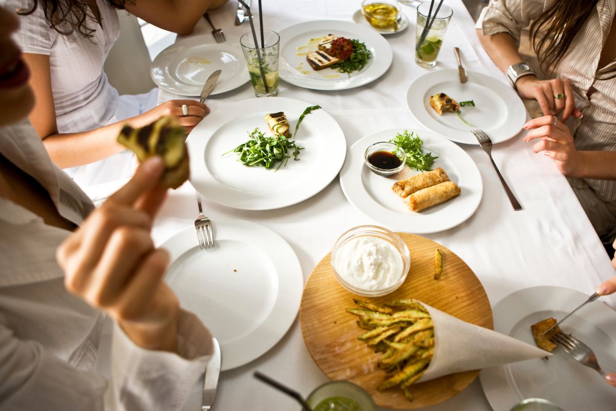Photo shows women eating at the restaurant.