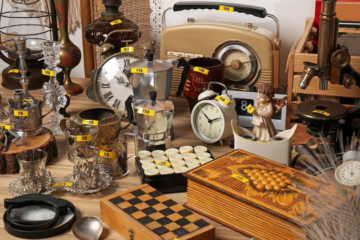 The image shows different items on the table with price tags indicating to search for vintage items to flip items for a profit.