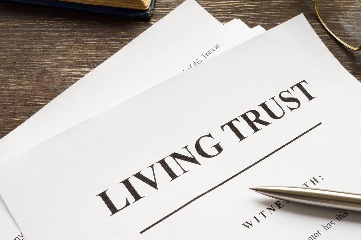 The photo shows paper with living trust wording.