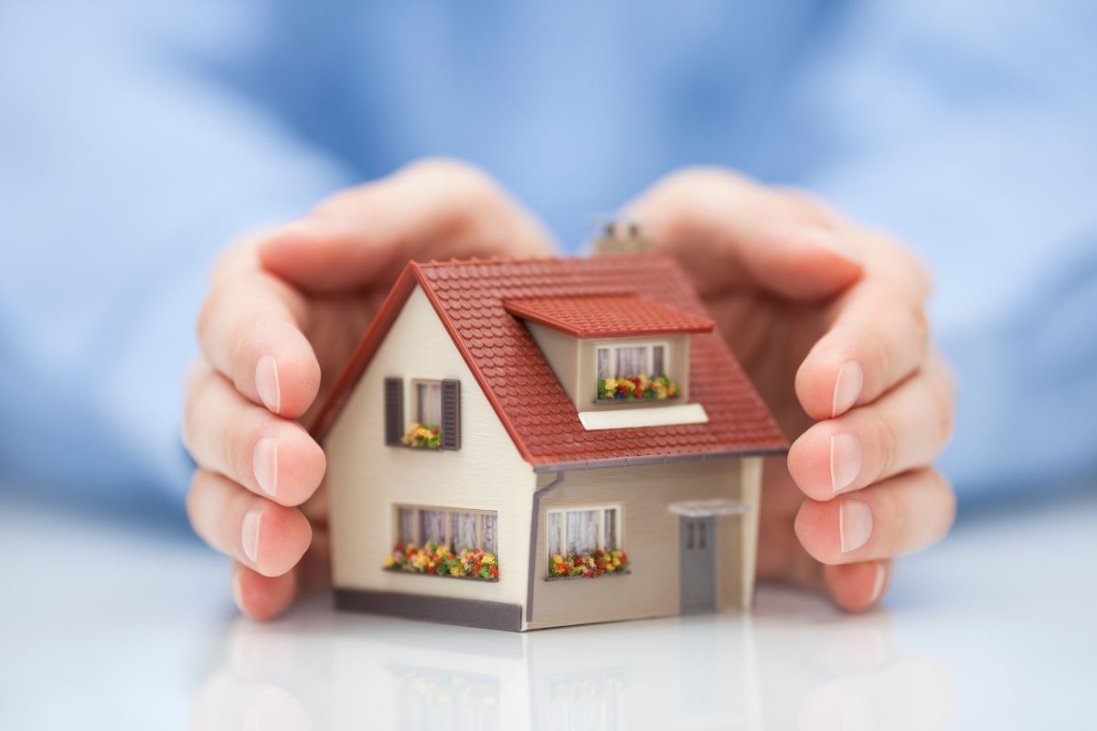 Picture of a woman's hand owning a property.
