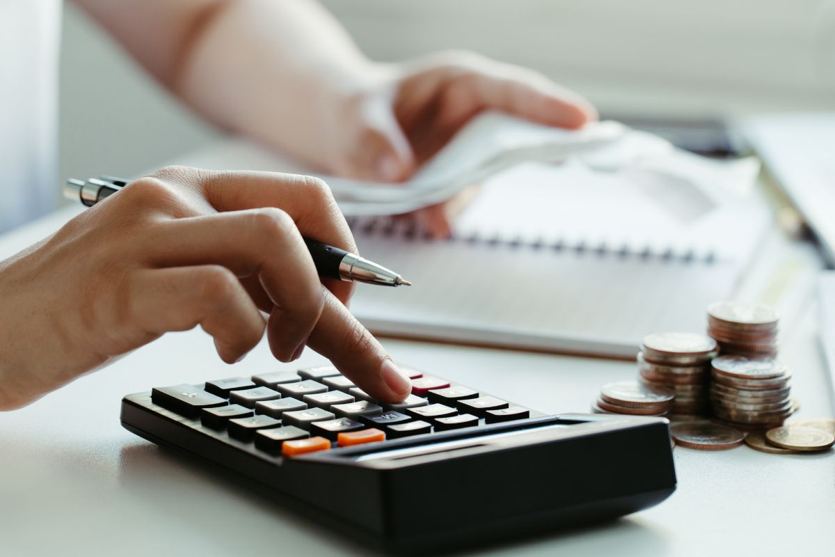 Photo of a woman's hand budgeting.