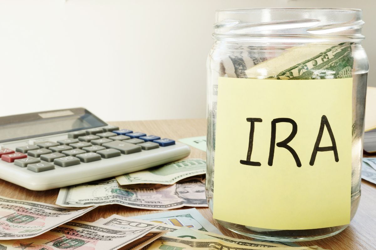 Picture of calculator and savings for IRA account.