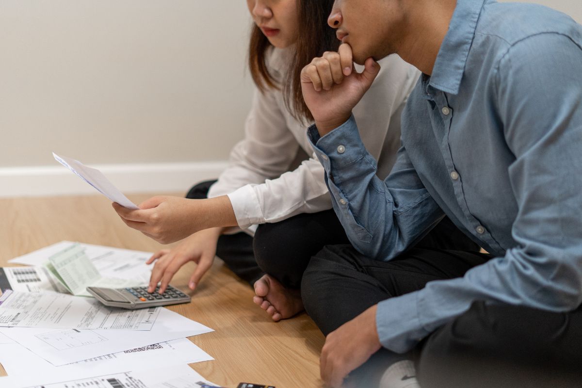 The image shows a couple of calculating invoices.