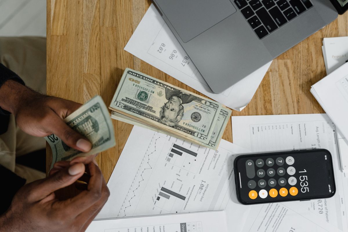 The image shows a woman tracking his net worth.