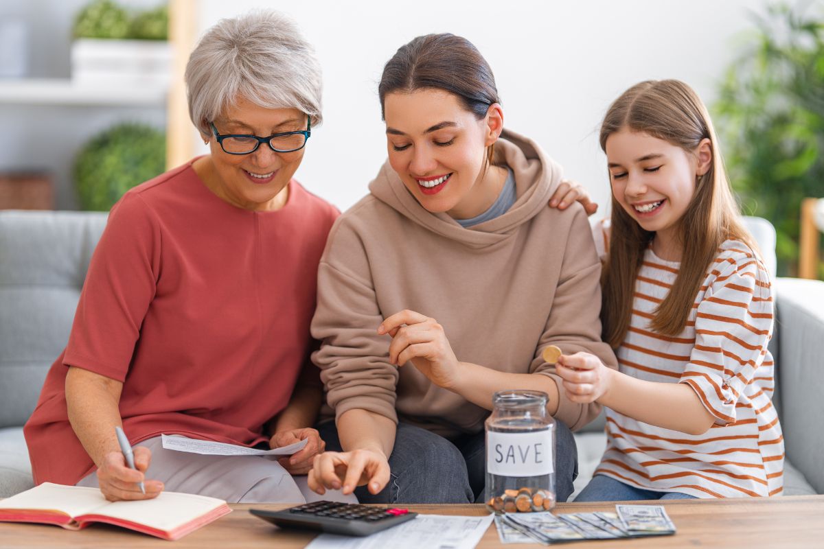The picture shows elders teaching their loved ones to manage money.