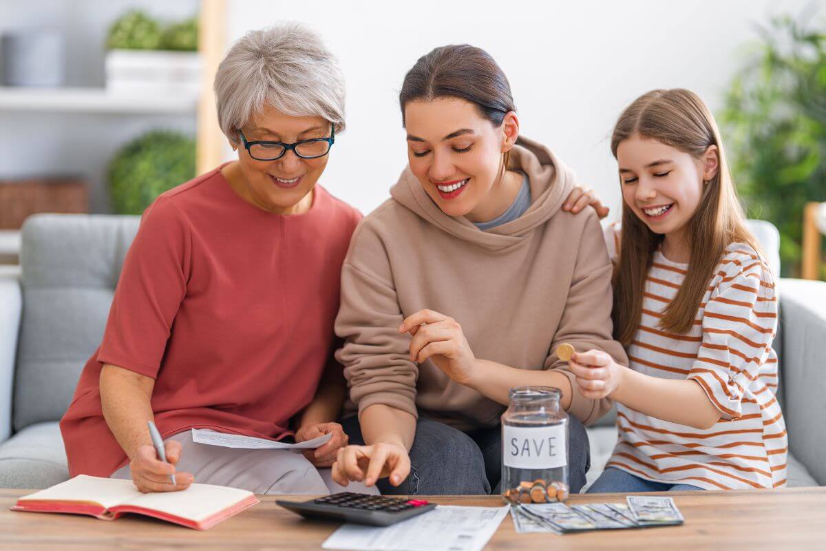 The photo shows dollar bills on the table, papers, a jar with coins, a kid dropping a coin to it, a senior writing on the notebook while holding a paper, and her daughter calculating referring to address any special instructions for minor children or dependents help avoid confusions or court involvement when it comes to their future.