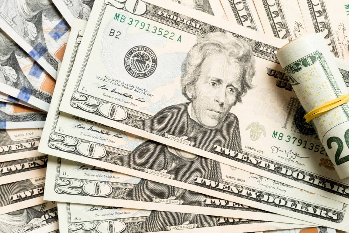 The image tells about dollar bills which means to start small to begin investing and helps you learn without feeling like you're risking too much.
