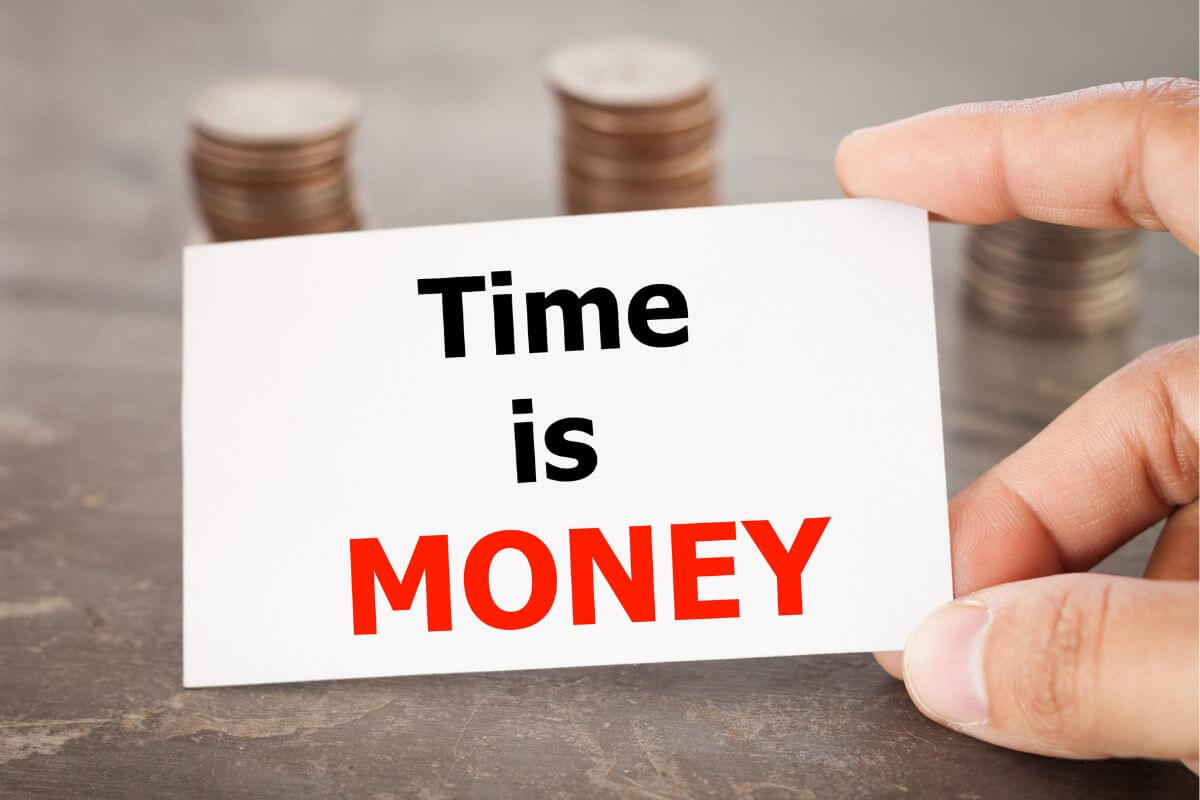 The image of coin stock and a man's hand holding a piece of paper with notes indicating to repeat these money affirmations can help you stay focused and motivated as you work toward financial stability.