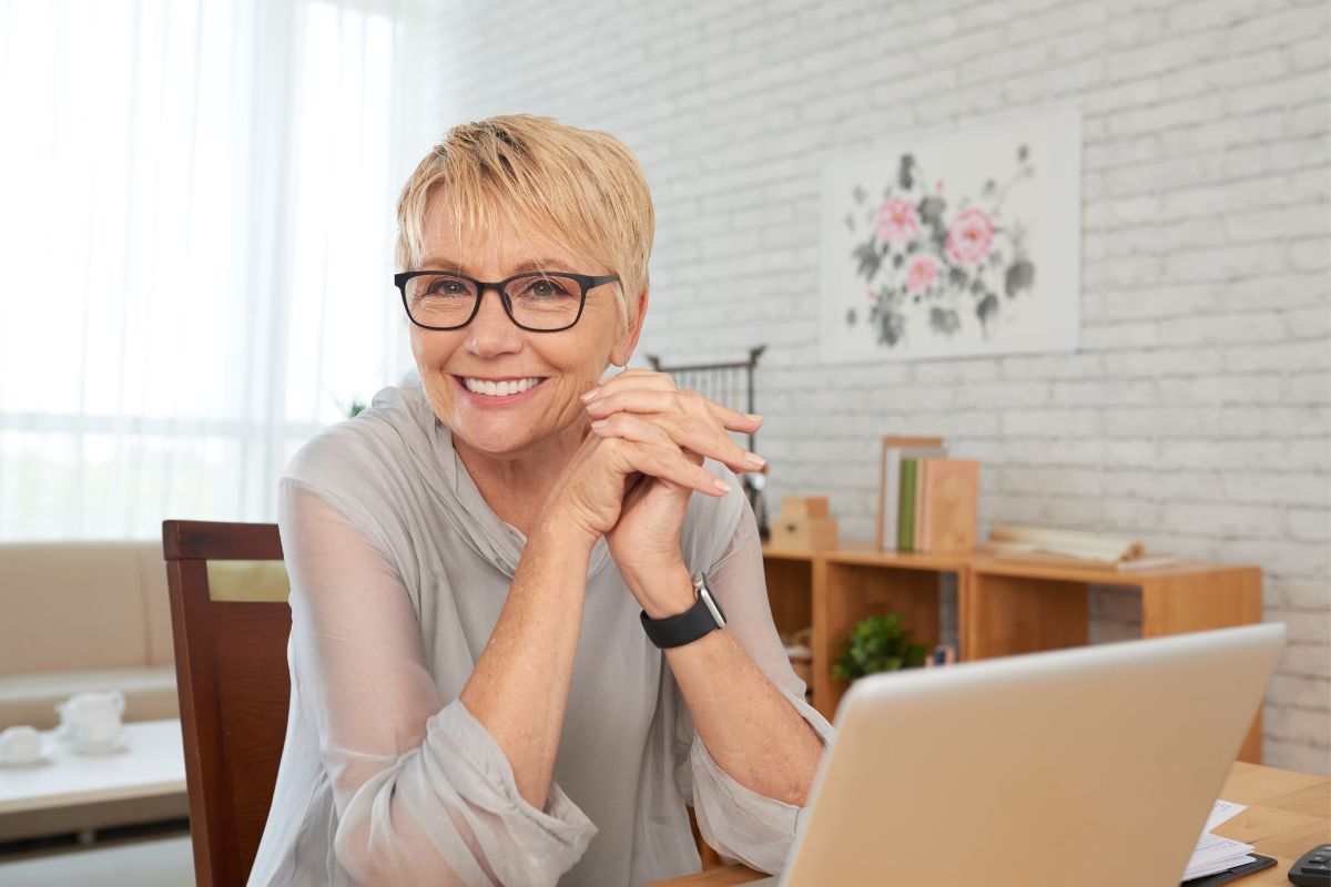 Image of an older woman using a laptop.