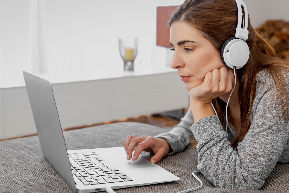 A woman listening to music while working.