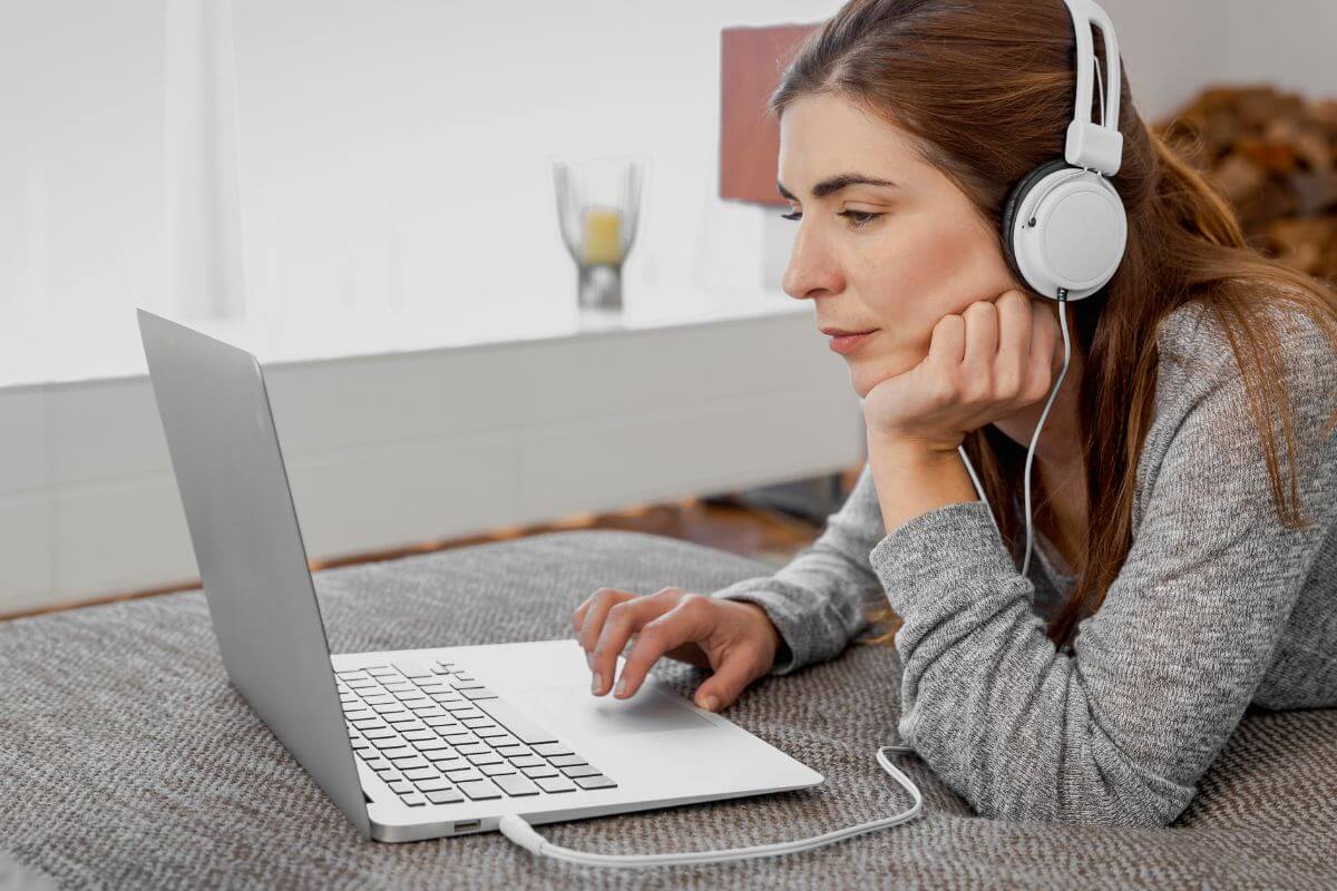 Then picture tells about a girl using a headset while using a laptop indicating to listen to focus-boosting music can improve your ability to stay on task.