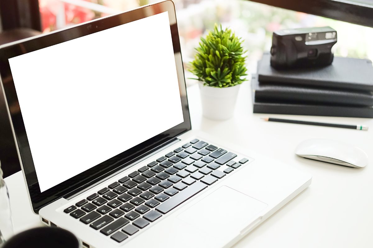 Picture of notebooks and a laptop.