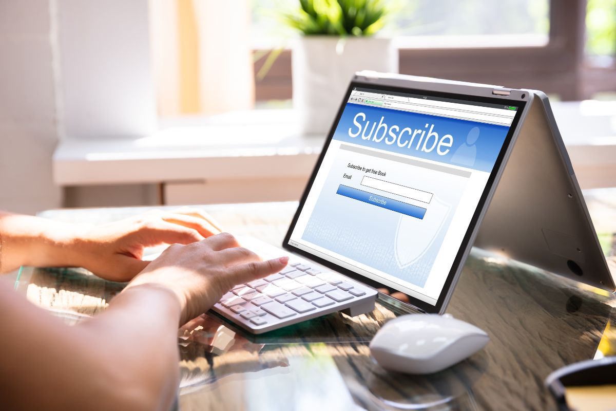 Photo of a woman's hand canceling subscription services.