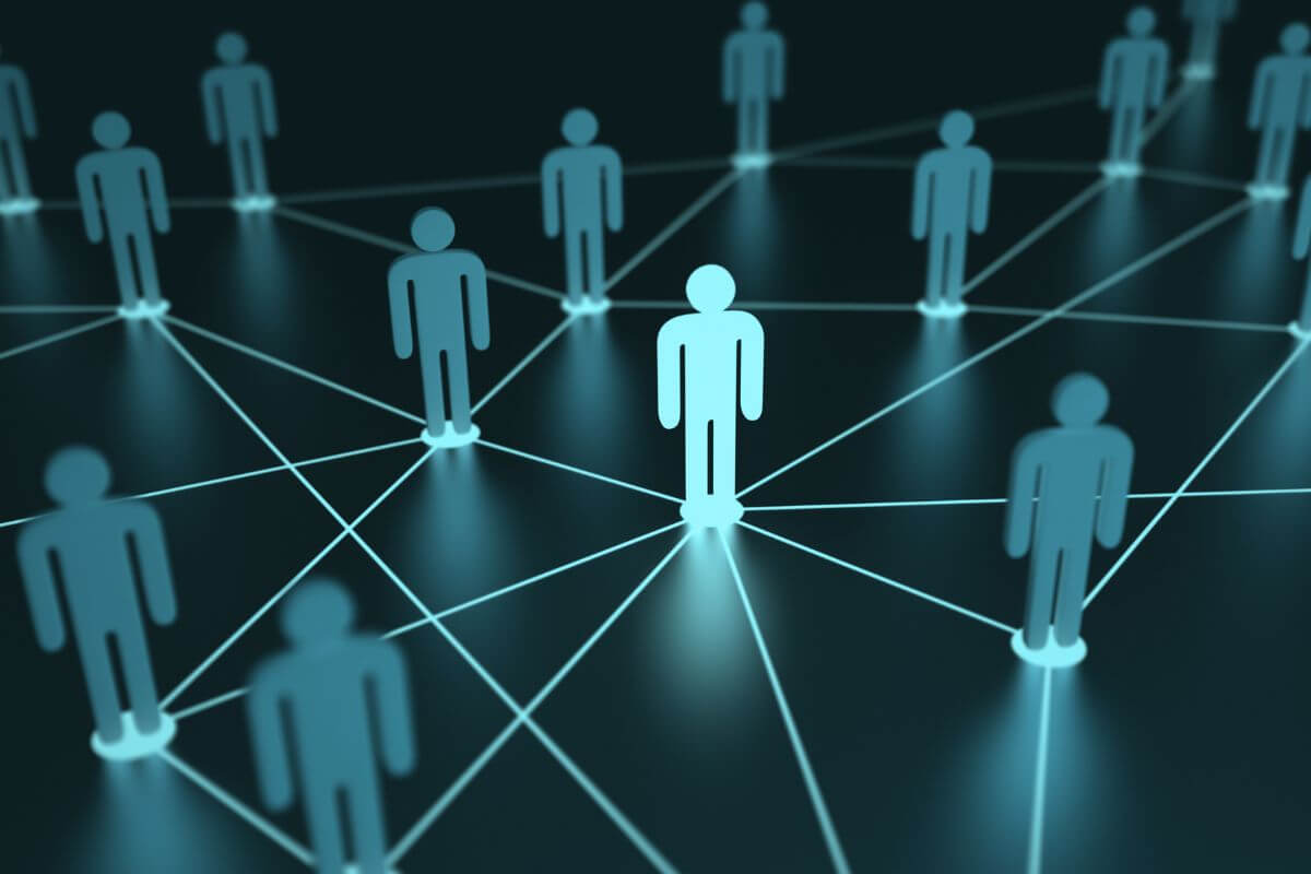 The picture shows people together with lines which means networking can help you find new opportunities if job loss happens.