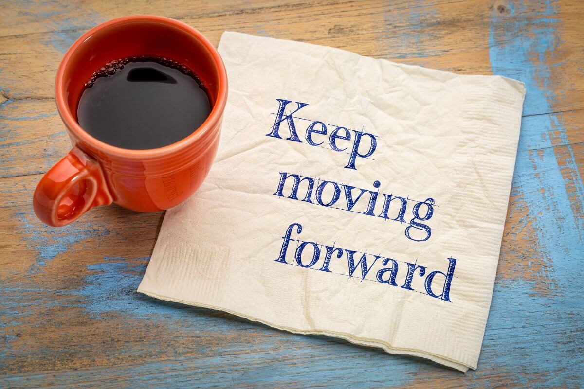 The photo of a coffee and a tissue with notes means to remind yourself that every small step is progress that will lead eventually to financial stability.
