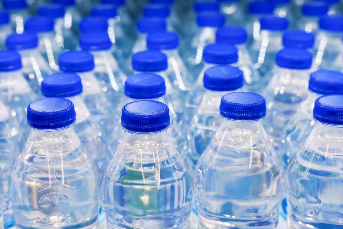 The image shows designer water bottles which can add up quickly, reusable bottle is a smarter choice.