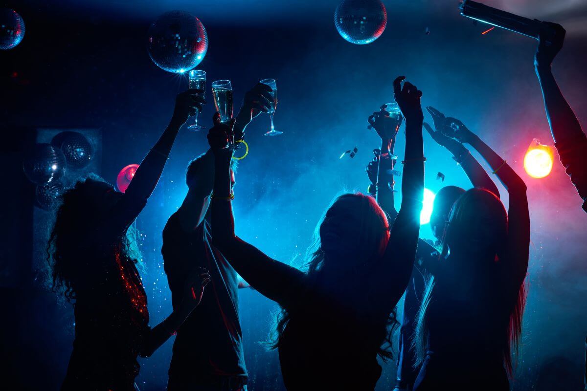 The image shows a group of people having fun together indicating that membership to clubs you never attend is just wasted money. Cancelling them frees up cash.