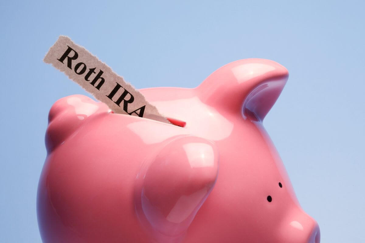 The photo shows a piggy bank with a piece of paper and notes referring to opening a custodial Roth IRA, which gives teens a head start on retirement savings.