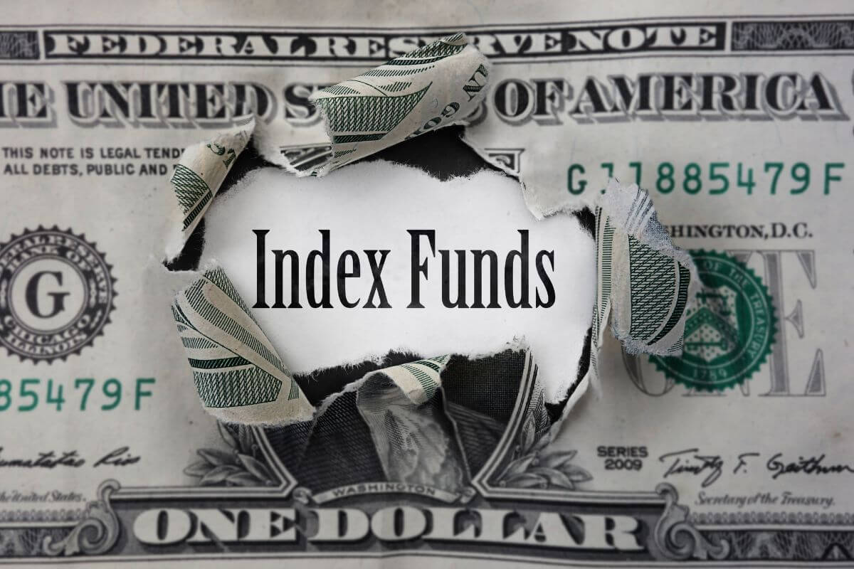 The photo tells about a dollar bill and a piece of paper with notes referring to encouraging investing in a simple index fund offers steady growth over time and is a smart way to build wealth.