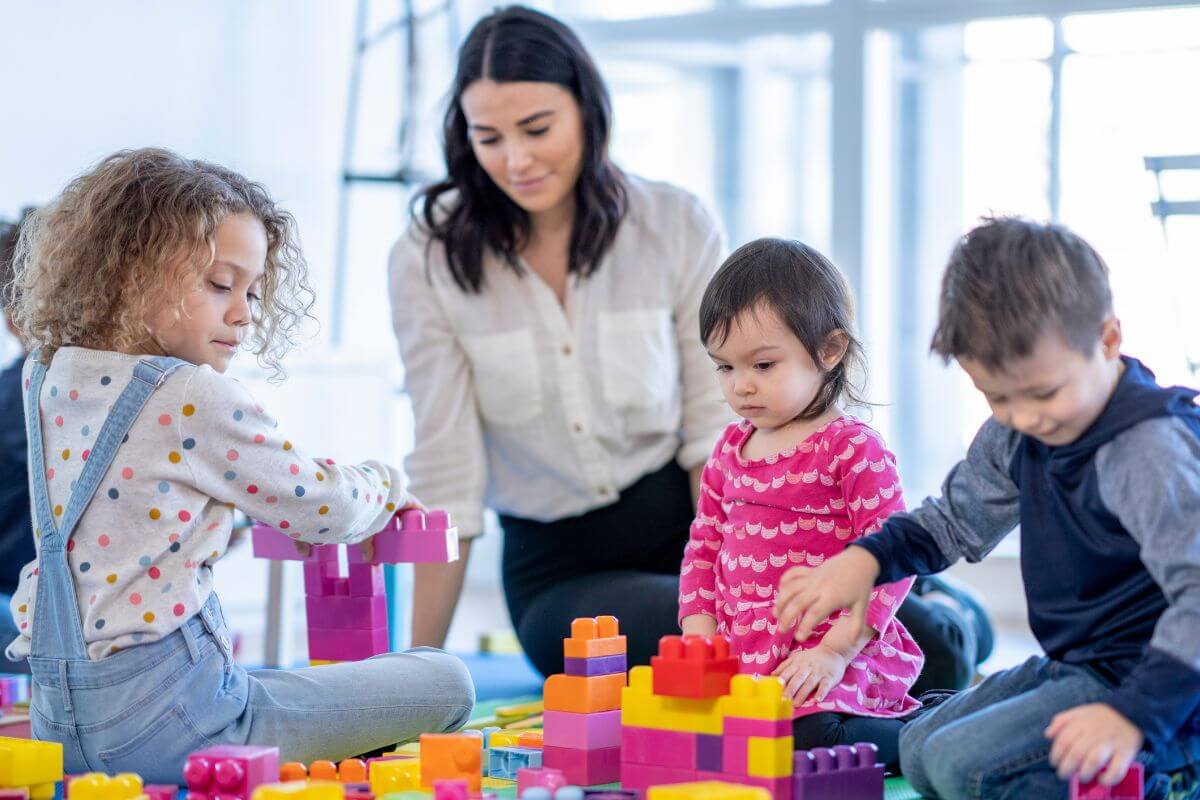 The image of kids playing together and a girl taking acre of them means to barter skills instead of paying for services whenever possible to keep more cash in your pocket for financial goals.