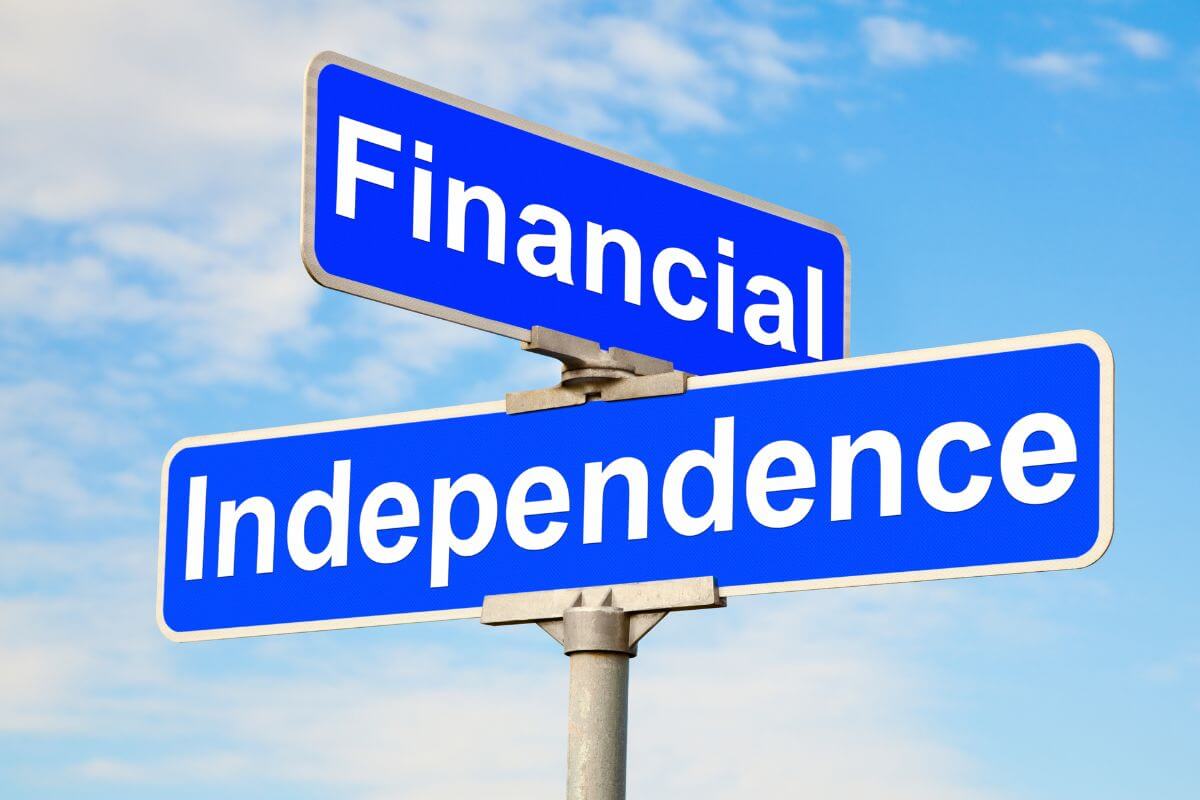 The image of a street sign with notes referring to treating financial independence like a life-or-death video game helps you reach financial independence faster.