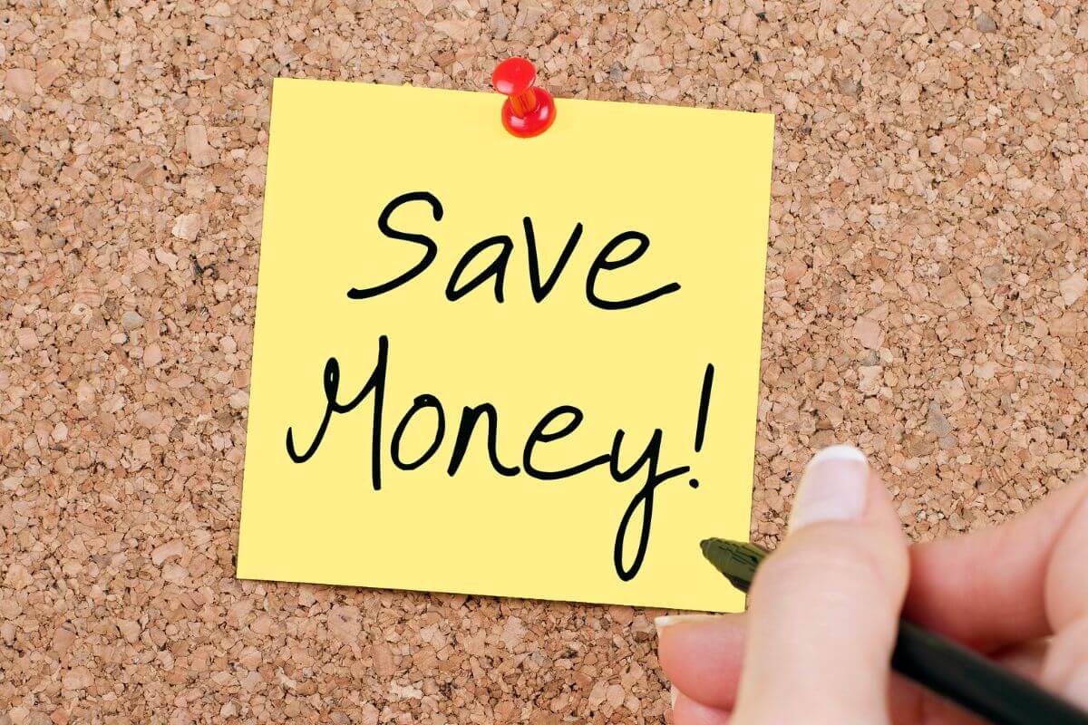 The picture of a piece of paper with notes and a girl's hand holding a pen indicating to more ideas to save money when broke and focus on your financial goals.