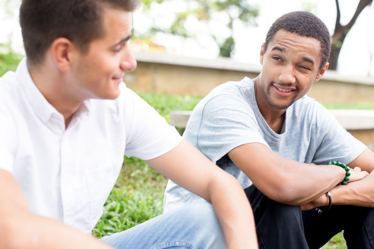 Image of men talking.