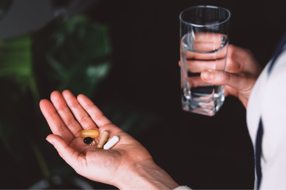 Picture of a woman drinking medicines.