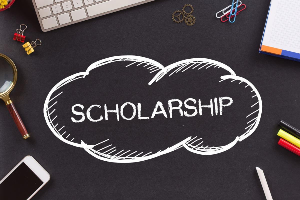 The picture shows a board with scholarship wording. 