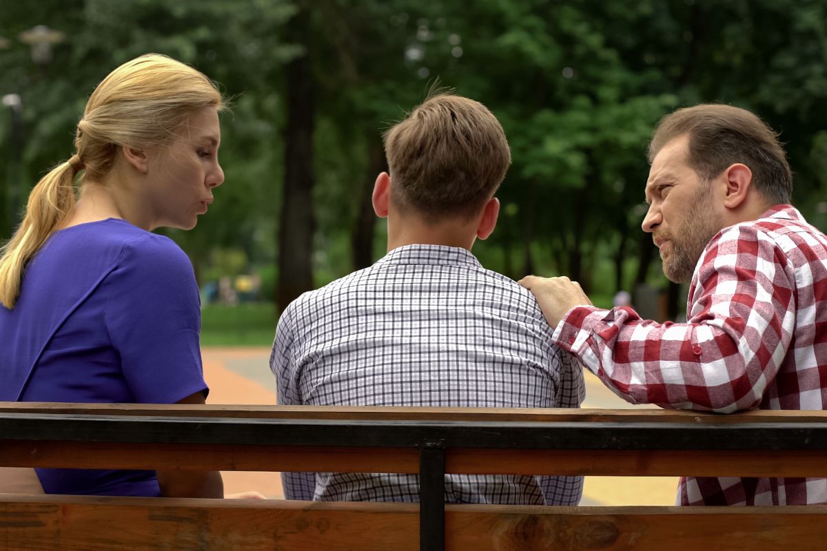 Picture of parents talking to their child.