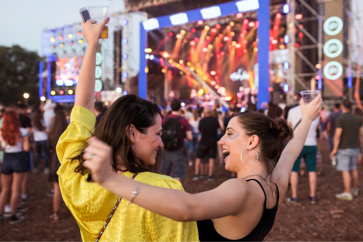 The image shows friends at a concert.