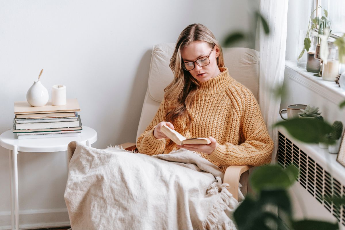 Picture of a woman reading a book.