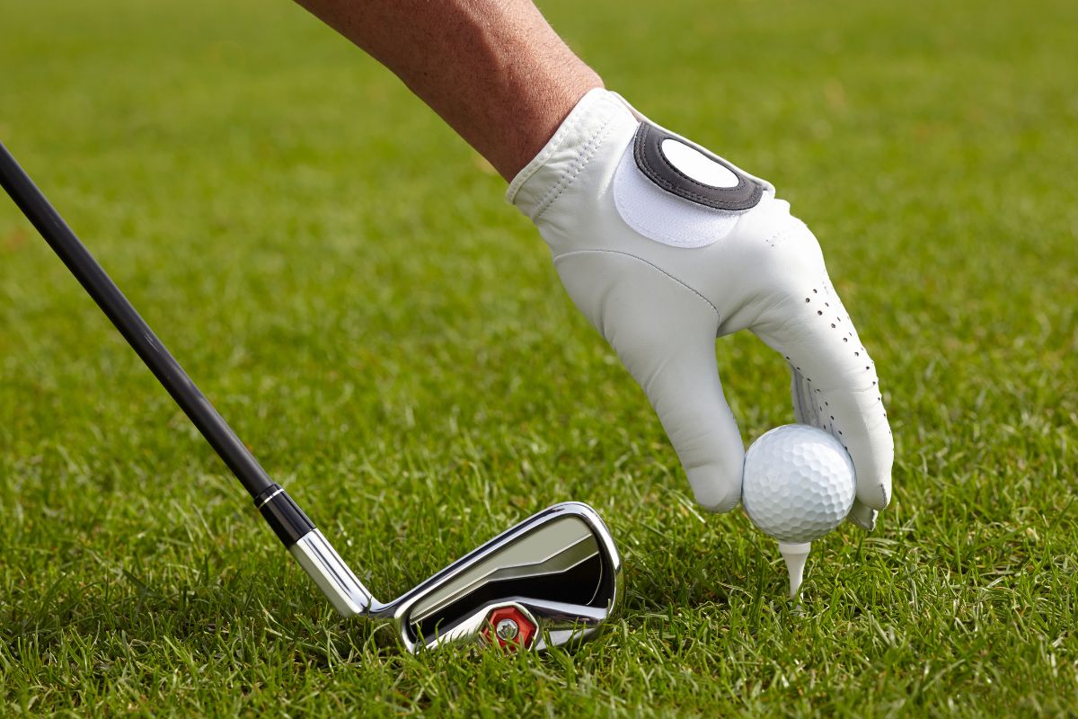 Photo of a man playing golf.