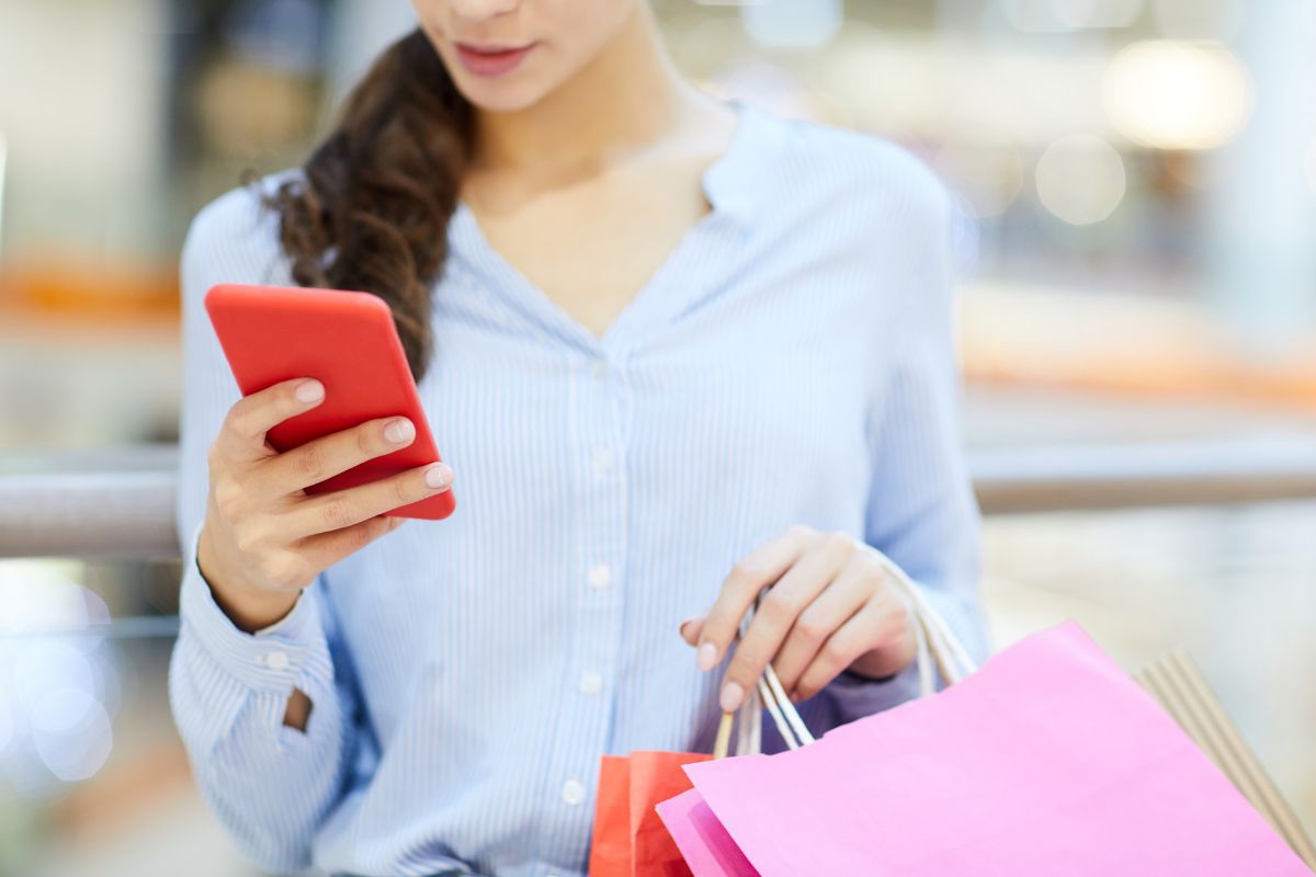 The image of a woman using a phone.