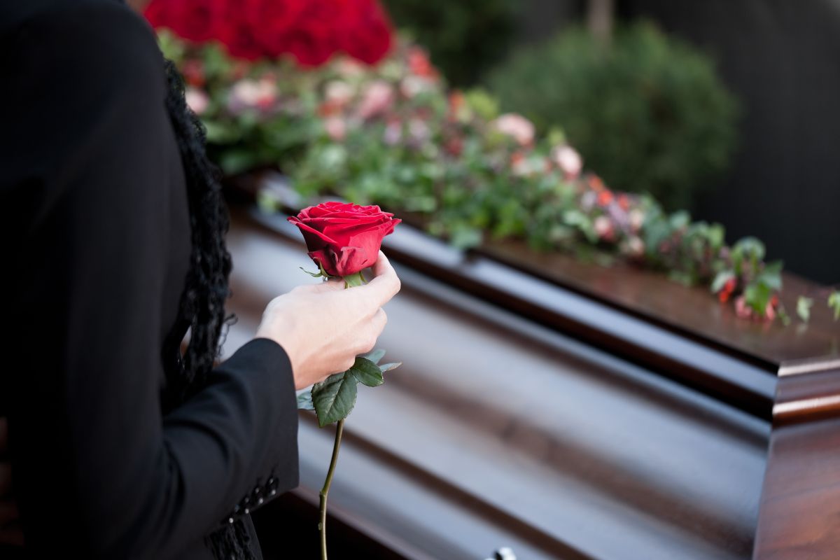 The photo of a woman attending a funeral.