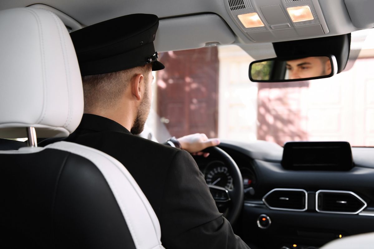 The picture of a man driving a car.