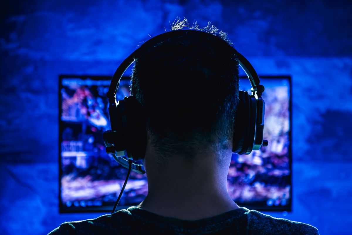 Image of a man playing video games.