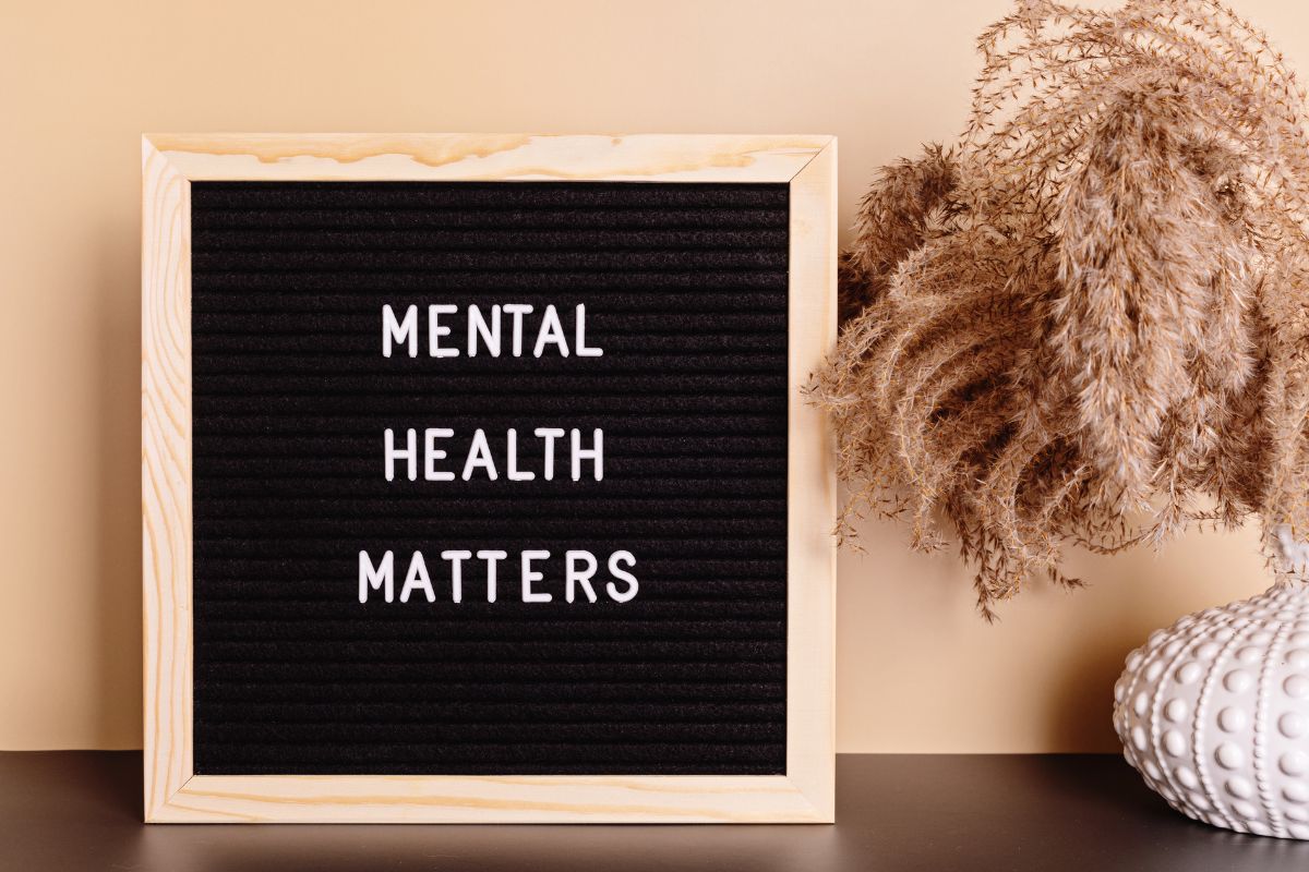 The image shows a board with mental health matters wording.