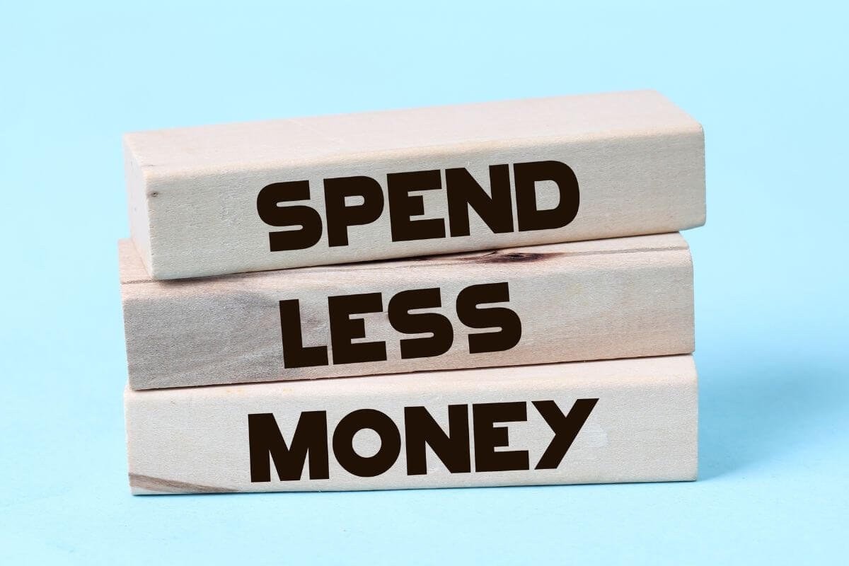 The picture tells about wooden rectangles with notes which means that repeating money mantras can keep you focused on your goals and help you stay on track.