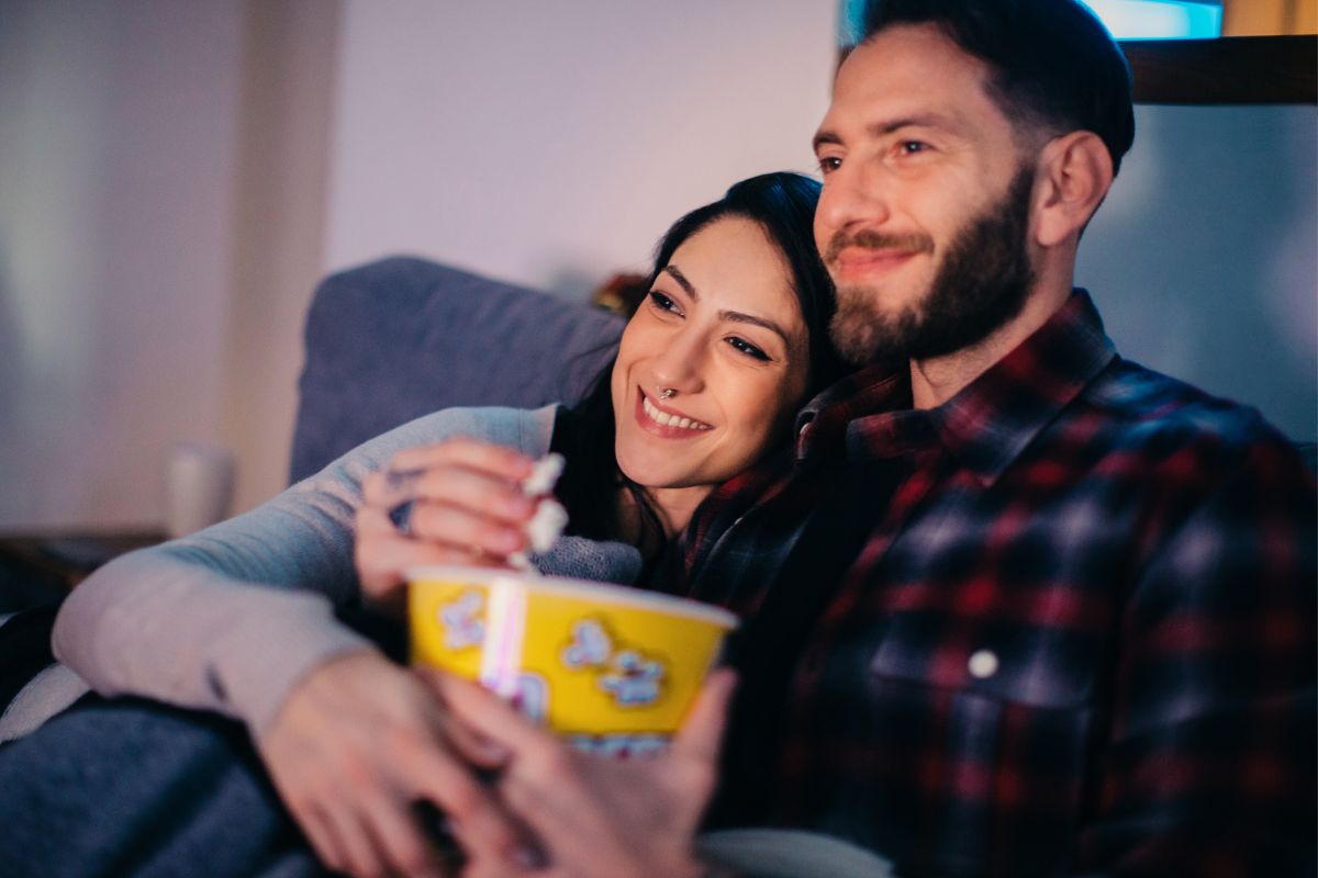 Photo of a couple watching a movie.