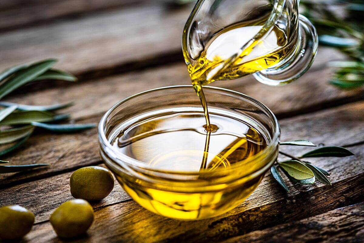 The picture shows leaves, olives, and a bottle pouring the bowl with oil which means gourmet olive oils often come with big price tags, regular extra virgin olive oil works just as well for cooking.
