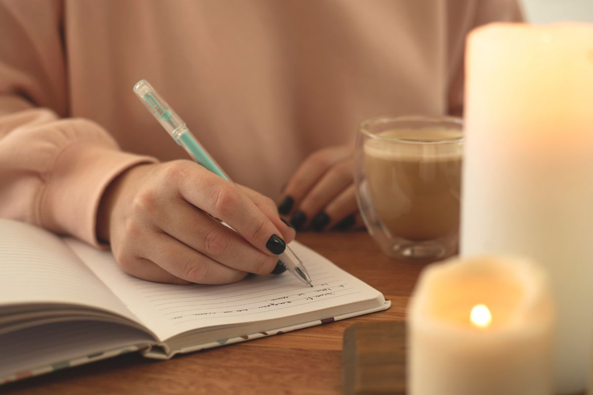 Picture of a woman making a journal.
