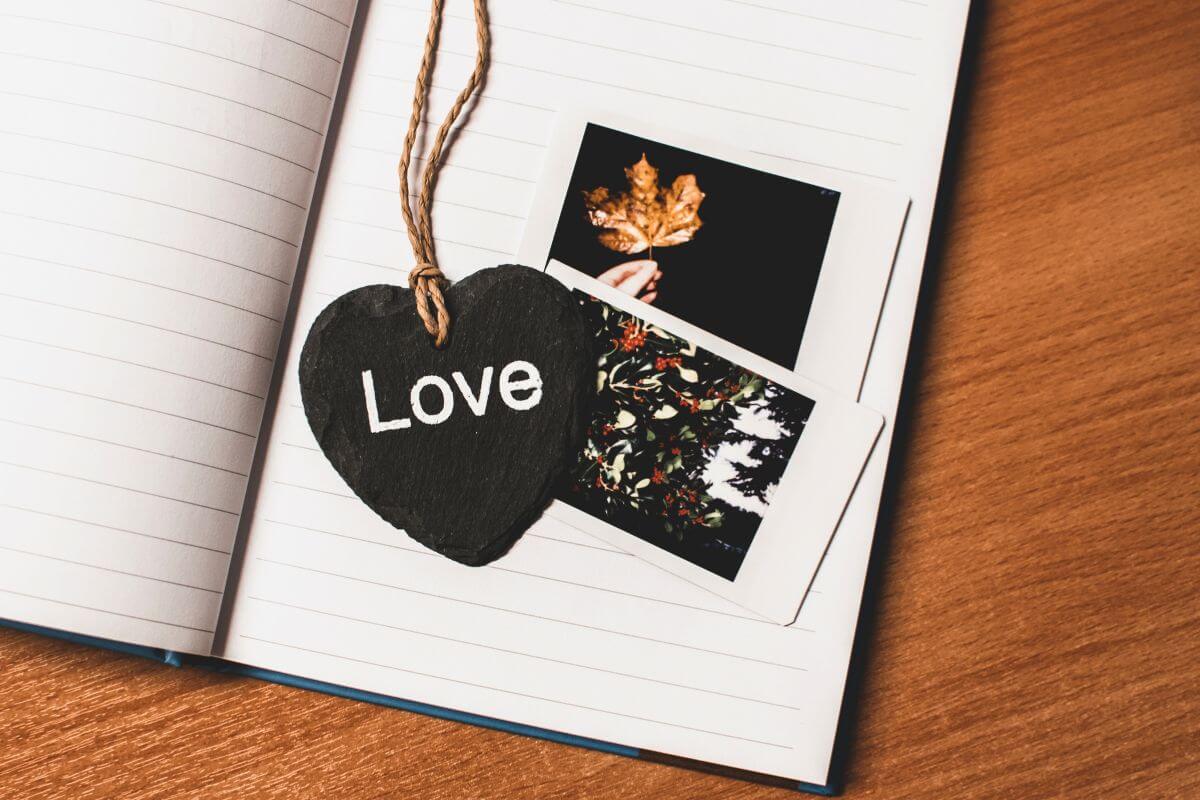 The photo shows a notebook, images, and a heart-shaped bookmark with a note referring to a bookmark with a heartfelt design you made which is a great idea for anyone who loves books and cozy reading moments.