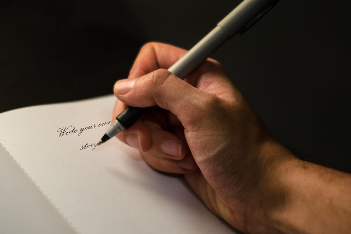 Picture of a man's hand making a poem.