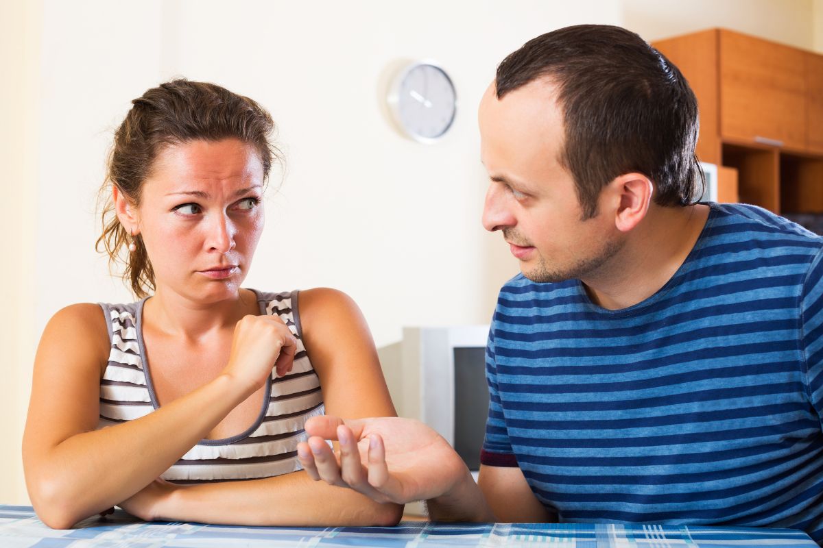 The picture shows a couple talking.