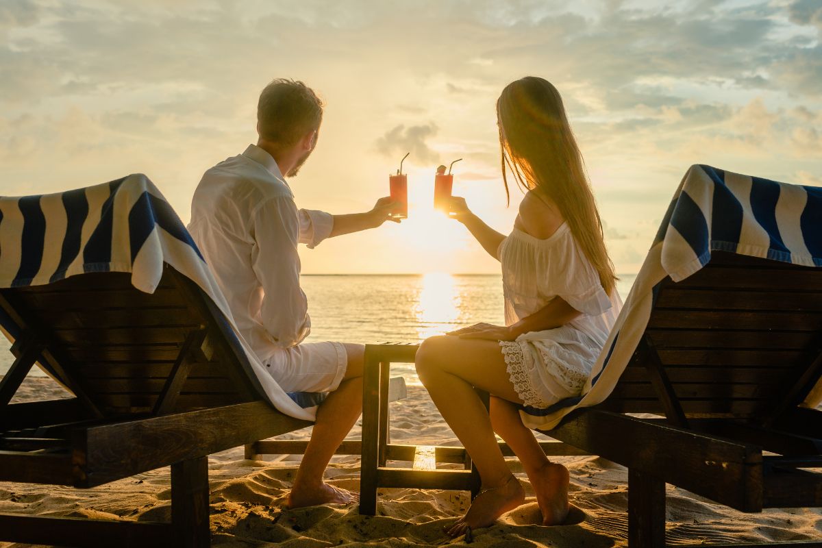 The photo shows a couple at the beach.