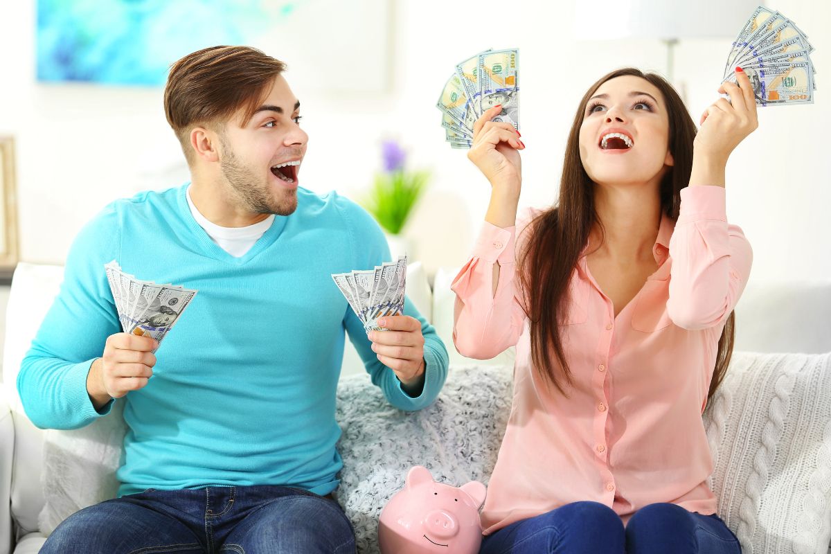 The photo shows a couple and their money.