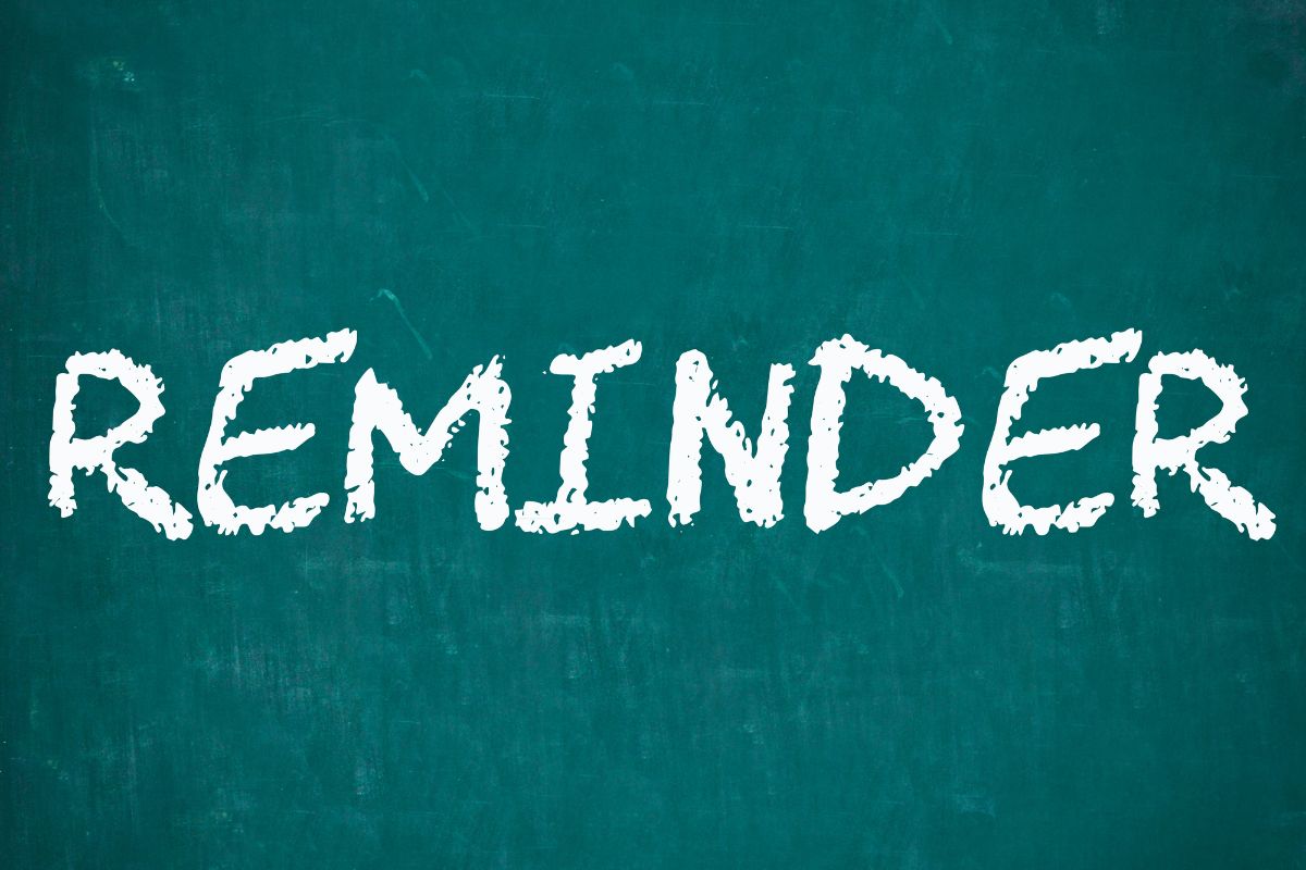 The image shows a board with reminder wording.